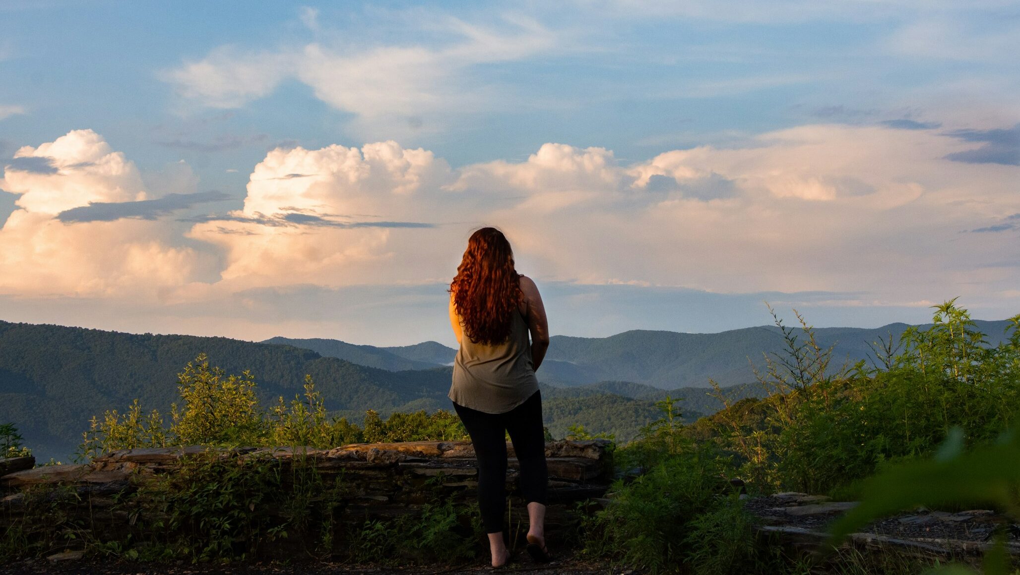 Admiring an Appalachian View. Photo by Abigail Ducote on Unsplash.